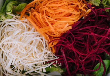 Slice fresh vegetables on the white plate
