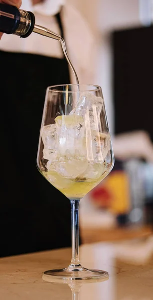 stock image bartender pours alcohol into a glass