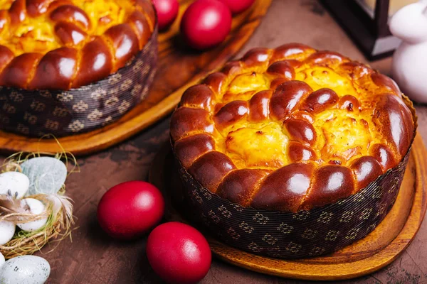 easter bread and eggs on wood