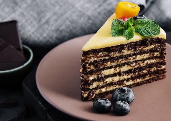 chocolate vanilla cake with berries on plate