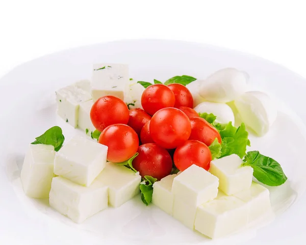 stock image Mozzarella cheese with cherry tomatoes and goat cheese