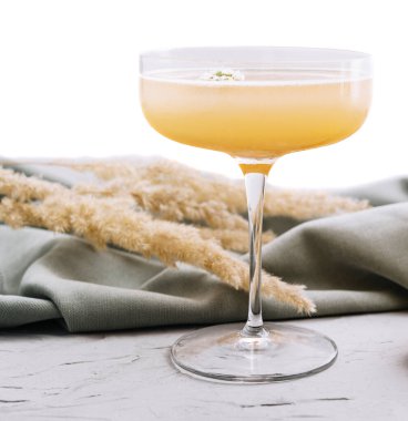 quince cocktail in a glass isolated