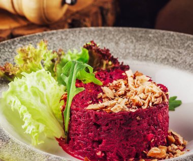 Warm beetroot, nuts and herbs salad