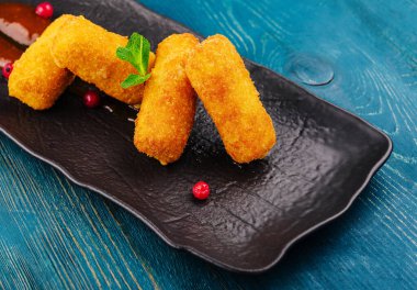 Breaded chicken strips with tomato ketchup