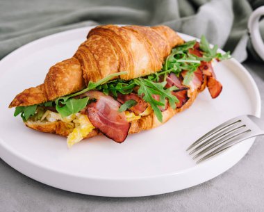 Fresh sandwich with bacon and scrambled eggs