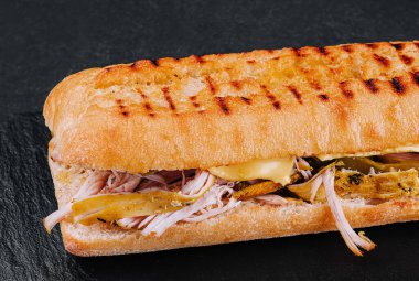 Big sandwich with chicken on stone board