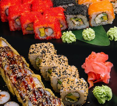 set of colorful different kinds of sushi rolls