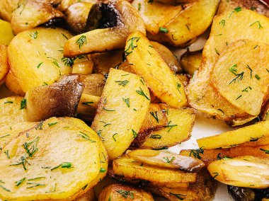 Potatoes with fried mushrooms on a plate