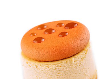 Piece of delicious cake with caramel on white plate