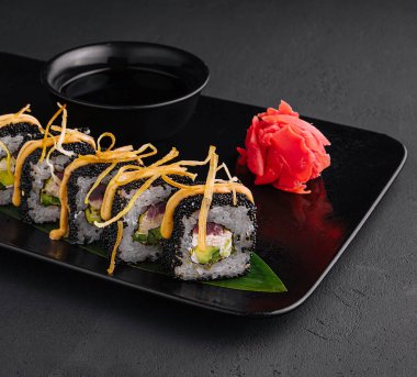 Sushi rolls with tuna and black caviar