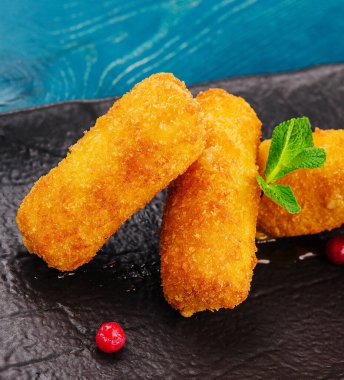 Breaded chicken strips with tomato ketchup