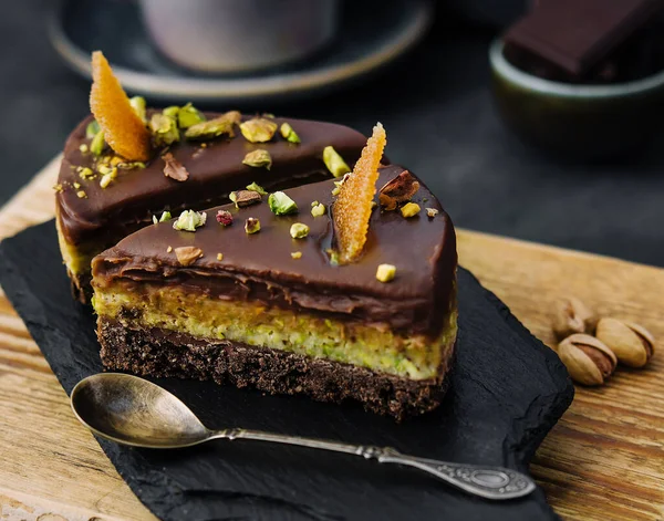 stock image Slice pistachio cake on wooden board