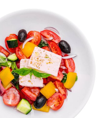 Greek salad of organic vegetables with tomatoes, cucumber, red onion, olives