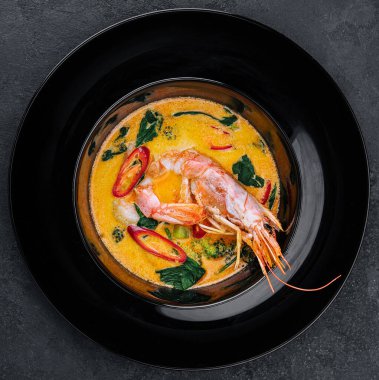 Tom yam is a spicy soup with shrimp. Restaurant soup food.