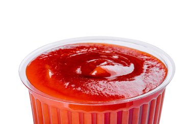 ketchup in a plastic bowl isolated on white