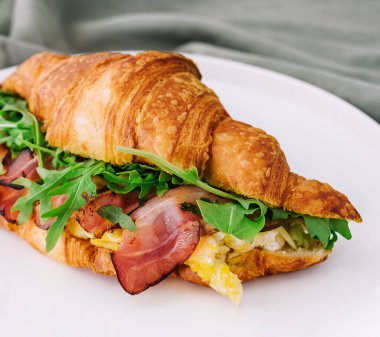 Fresh sandwich with bacon and scrambled eggs