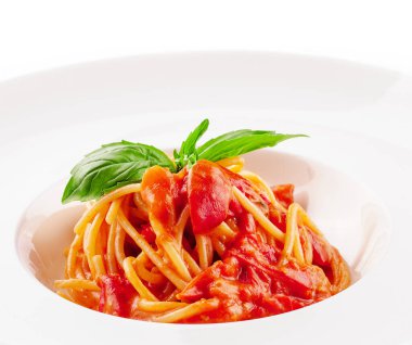 Spaghetti with tomato sauce and cherry tomatoes with basil