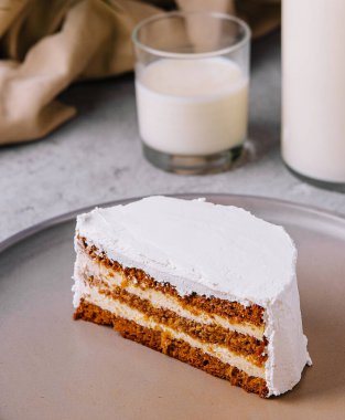 Carrot cake and cream cheese with milk