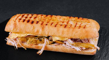 Big sandwich with chicken on stone board