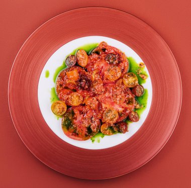 Gnocchi fried with cherry tomatoes with basil and spinach pesto