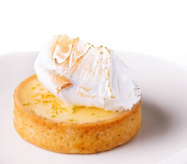 Lemon tartlet with meringue on plate