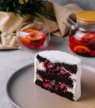 winter christmas cake with cherries with tea