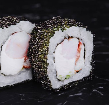 sushi rolls - Phila Black with black caviar, shrimp and cheese