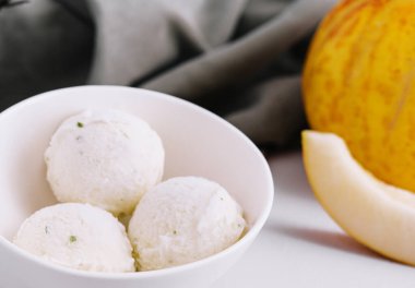 melon ice cream scoops in bowl