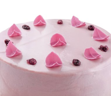 Pretty pink cake decorated with icing sugar roses