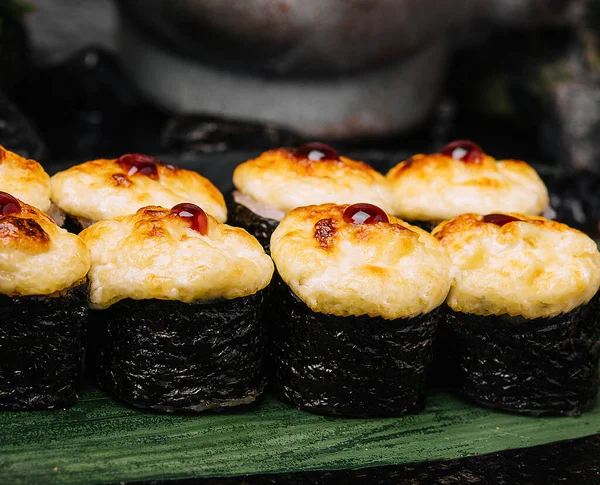 stock image Served warm sushi rolled in nori sheets