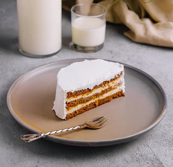 Carrot cake and cream cheese with milk