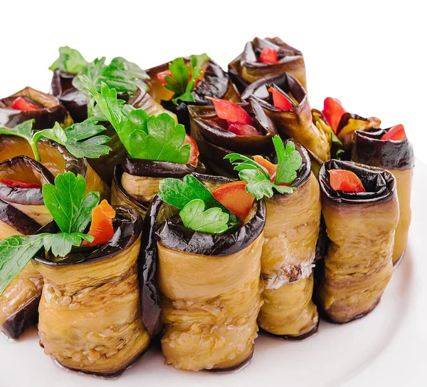 Rolls of fried eggplant stuffed with mayonnaise and tomatoes