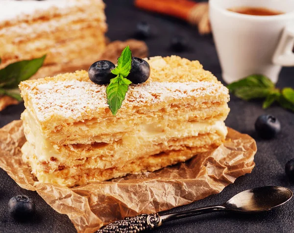 baked cake Napoleon, Millefeuille garnished with blueberry and mint