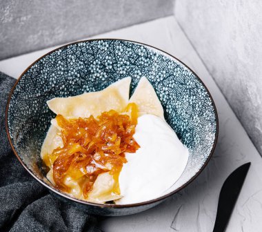 Boiled Vegan dumplings with potatoes with fried onions