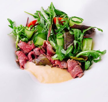 Meat Carpaccio with Rocket Salad on plate
