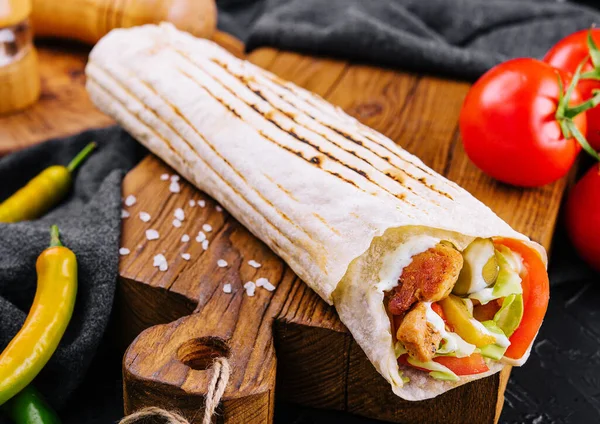 stock image Shawarma rolled in lavash, moist grilled meat