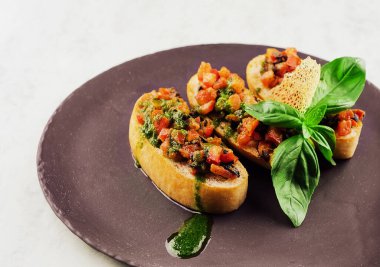 Bruschettas with pepper and pesto sauce