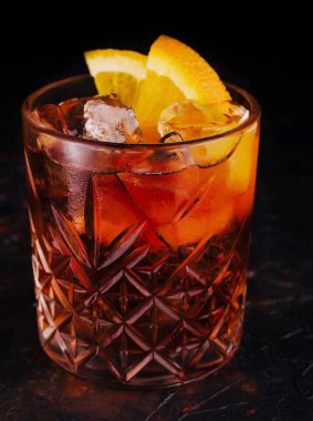 Classic Negroni Cocktail with orange slices in glass
