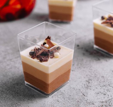 Layered dessert Trifles in a transparent glasses