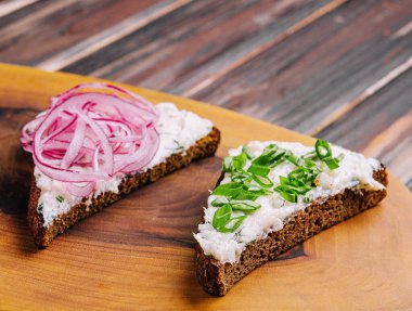 pieces of bread with delicious lard with red and green onions