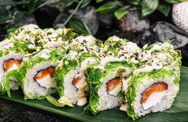 Sushi rolls with salmon, cream cheese in seaweed