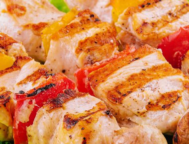 pork skewers with grilled bell peppers and mushrooms