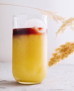 Glass of tasty coffee with orange juice