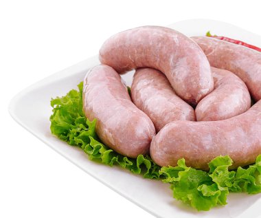 Fresh raw pork bratwurst isolated on a white background