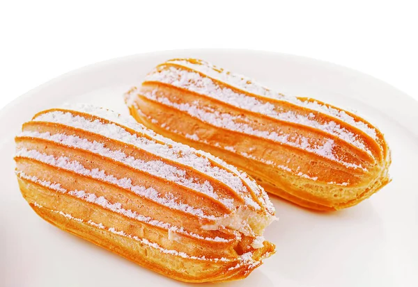 Two Eclairs White Plate Isolated — 图库照片