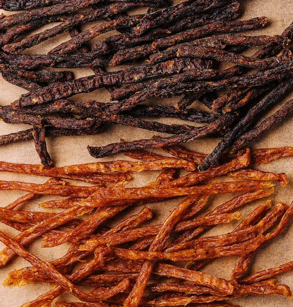 stock image Beef and chiken jerky on wooden board