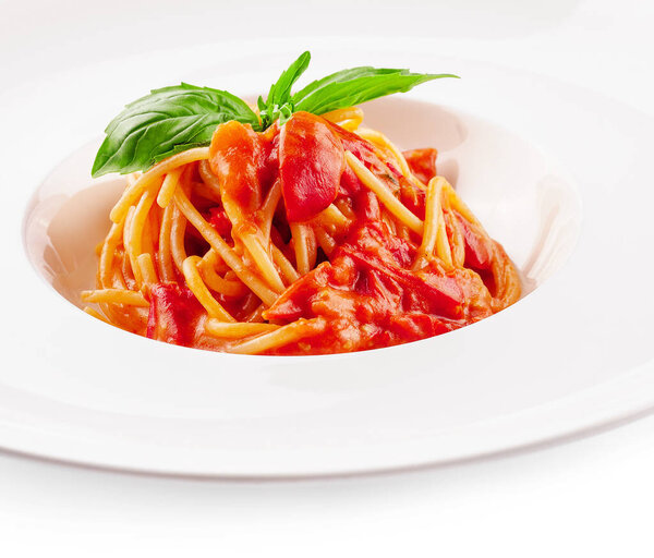 Spaghetti with tomato sauce and cherry tomatoes with basil