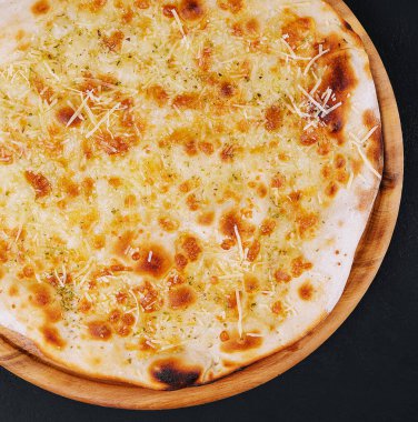 Garlic pizza bread with cheese and herbs