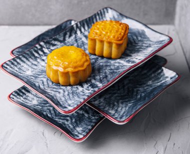 two chinese cakes on traditional plates