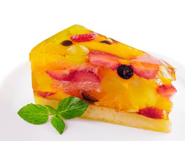 Jelly cake with fruit on white plate